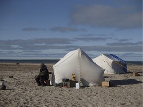 Guardian Raymond Niaqunnuaq keeps watch at Davit camp on Saunitalik Island near Gjoa Haven Nunavut, on Friday September 1, 2017. Guardians protect the area as crews work to recover artifacts left on the sunken Franklin ship the Erebus.