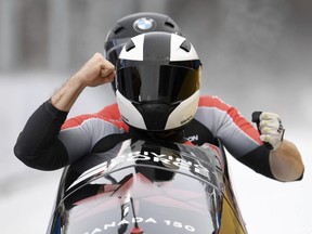 Canada's Justin Kripps and Alexander Kopacz celebrate after taking the third place at the two-men bobsled World Cup in Koenigssee, Germany, on Jan. 20.