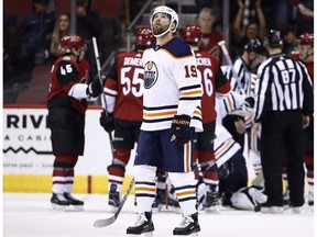 Edmonton Oilers left wing Patrick Maroon (19) looks at the scoreboard after a goal by Arizona Coyotes center Christian Dvorak during the first period of an NHL hockey game Saturday, Feb. 17, 2018, in Glendale, Ariz. The Oilers dealt veteran forward Maroon to the New Jersey Devils on Monday prior to the NHL trade deadline.