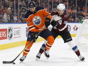 Edmonton's Zack Kassian (44) battles Colorado's Nikita Zadorov (16) during the first period of a NHL game between the Edmonton Oilers and the Colorado Avalanche at Rogers Place in Edmonton, Alberta on Thursday, Feb. 22, 2018. Photo by Ian Kucerak/Postmedia