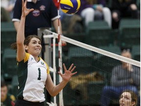 University of Alberta Pandas' Shauntelle Hogg spikes the ball against the Trinity Western University Spartans during a Canada West best of three quarter-final game in Edmonton, Alberta on Friday, Feb. 23, 2018.