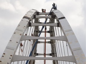 Construction crew members work are seen at work on the new Walterdale Bridge in Edmonton, Alta. on Tuesday, May 16, 2017.