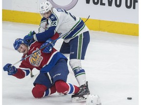 Nick Bowman of the Edmonton Oil Kings, is roughed up by Max Patterson of the Swift Current Broncos at Rogers Place in Edmonton on February 25. Photo by Shaughn Butts / Postmedia