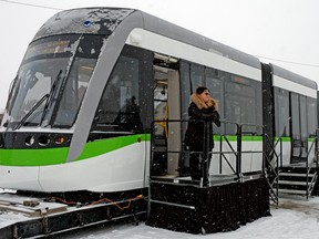 Bombardier project administrator Marie-Claude Dubois stands outside Bombardier's new low-floor light rail vehicle which will be used on the Valley Line LRT in Edmonton. The line is planned to eventually run from Mill Woods, through downtown and to Lewis Estates.