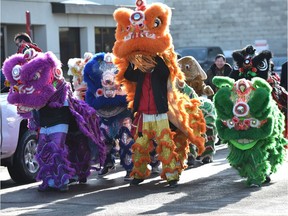 The Chinese New Year's Year of the Dog was celebrated on 97 Street in Chinatown with the lion and dragons firecracker parade in Edmonton on Feb. 17, 2018.