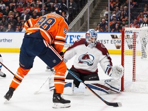Edmonton Oilers' Jesse Puljujarvi (98) looks for a shot on Colorado Avalanche's goaltender Jonathan Bernier (45) during second period NHL action in Edmonton on Thursday, Feb. 1, 2018.