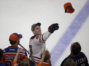 Connor McDavid (97) throws a hat to fans after taking part in the Edmonton Oilers skills competition on Saturday, Feb. 3, 2018 in Edmonton. Greg  Southam / Postmedia