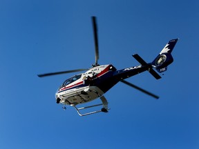 Edmonton Police Service Flight Operations Unit Air 1 chopper comes in for a landing outside the Edmonton Police Foundation's annual True Blue Gala at the Expo Centre in Edmonton on Wednesday Oct. 7, 2015.