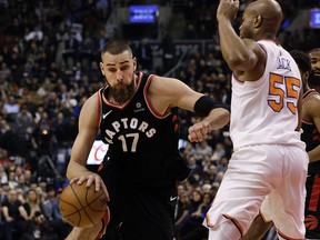 Toronto Raptors centre Jonas Valanciunas (17) drives to the basket as New York Knicks guard Jarrett Jack defends at the Air Canada Centre in Toronto, Ont. on Thursday February 8, 2018. (Stan Behal/Toronto Sun)