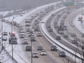 Traffic was backed up at the start of rush hour due to a collision on Quesnell Bridge as a snowy weather system moves through Edmonton, February 2, 2018. Ed Kaiser/Postmedia