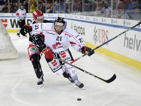 Canadian forward Chris Kelly battles for the puck against Mountfield at the Spengler Cup in Davos, Switzerland, on Dec. 26, 2017.