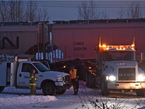 A CN train struck this semi-truck low-boy carrying a back hoe, derailing 14 train cars and two locomotives just after 3 p.m. Thursday, Feb. 8, 2018. CN crews are on site working on the cleanup in the town of Wabamun about 75 km west of Edmonton. One of the CN crew members was taken in to hospital for assessment.