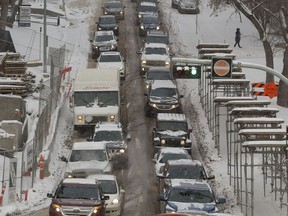 Drivers make their way down 106th street towards 97 avenue on a cold snowy Friday, Feb. 2, 2018 in Edmonton.