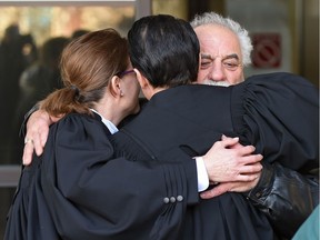 A family member gives the defence team a hug after the verdict in the Christine Longridge trial in the death of her daughter Rachael Longridge at the Court House in Edmonton, Feb. 28, 2018.