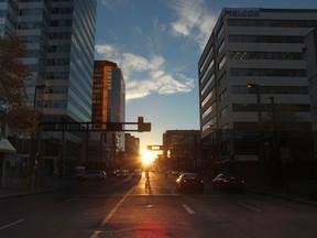 Edmontonhenge happens during the spring and autumn equinoxes when the sun rises due east and sets due west which makes the sun rise or set along most of the avenues in Edmonton. This picture was taken looking west along Jasper Avenue.