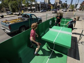 (left to right) Trevor Dunn, Alex Garneau, and Shawn Skinner play table tennis in a pop-up park along Jasper Avenue near 112 Street, in Edmonton Tuesday Aug. 8, 2017. The park was part of the Experience Jasper Avenue Design Demo, which includes pop-up parks, murals, trees and landscaping, along Jasper Avenue between 109 Street and 115 Street.