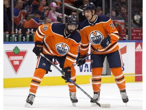 Edmonton Oilers Jujhar Khaira (16) and Ethan Bear (74) talk during the pre-game warmup against the Nashville Predators at Rogers Place in Edmonton on Thursday, March 1, 2018. (David Bloom)