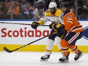 The Edmonton Oilers' Ethan Bear (74) battles the Nashville Predators' P.K. Subban (76) during first period NHL action at Rogers Place in Edmonton Thursday March 1, 2018.