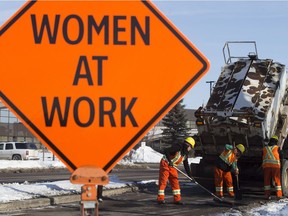 An all-female City of Edmonton road crew fill potholes along Airport Road north of Kingsway in Edmonton Thursday March 8, 2018. The crew is made up of City of Edmonton Parks and Roadway maintenance workers, but the all-female crew was created just for International Women's Day.