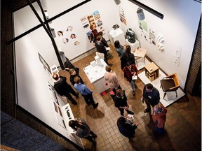 People check out designs on showcase during the University of Alberta Bachelor of Design's Please Touch industry night reception at the FAB Gallery on campus in Edmonton on Wednesday, March 28, 2018.