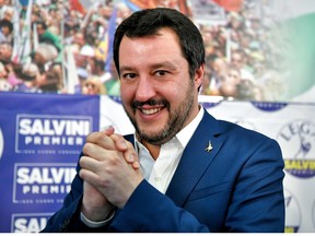 Lega far right party leader Matteo Salvini joins his hands during a press conference held at the Lega headquarter in Milan on March 5, 2018 ahead of the Italy's general election results.