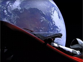 A still image taken from a SpaceX livestream video shows Starman sitting in SpaceX CEO Elon Musk's cherry red Tesla roadster after the Falcon Heavy rocket delivered it into orbit around the Earth on Feb. 6, 2018.