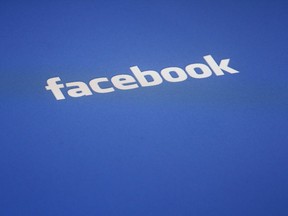 A Facebook logo is displayed on the screen of an iPad in a Wednesday, May 16, 2012 file photo taken in New York.