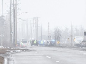 Police investigate a serious collision on 17 St north of Whitemud Drive in Edmonton on Wednesday, March 28, 2018.