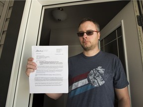 Shayne Bundus holds a letter he received on Friday, March 16, 2018, from Alberta Environment and Parks and Alberta Health Services related to a former creosote treatment plant in northeast Edmonton.