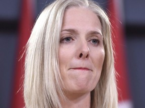 Minister of Environment and Climate Change Catherine McKenna listens to a question during a press conference on the government's environmental and regulatory reviews related to major projects, in the National Press Theatre in Ottawa on Thursday, Feb. 8, 2018.