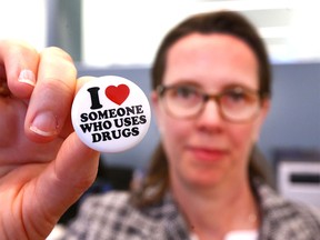 Dr Bonnie Larson, a Calgary family physician, displays her lapel pin at a Government of Alberta press conference in Calgary on Friday, March 2, 2018 to announce new funding and tools for family doctors helping to battle the opioid crisis in the province. Jim Wells/Postmedia