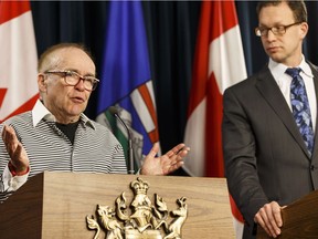 Marlin Schmidt (right), Alberta's Minister of Advanced Education, announces the appointment of Michael Phair (left) as the Chair of the University of Alberta's Board of Governors, during a press conference at the Alberta Legislature in Edmonton, Alta., on Thursday February 25, 2016.