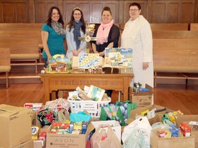 Throughout December the congregation of Exeter United Church completed a reverse advent box challenge, filling boxes with non-perishable food items for the Exeter Community Food Bank. During the Jan. 8 church service, Rev. Laurie O'Leary, right, presented the food donations to, from left, Kelly Fletcher, Mary MacFarlane and Laurie Clapp. Jan. 8, 2017.