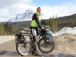 Jasper fire Chief Greg Van Tighem and his trusty fat bike take a break during training before they this week tackle the 500-km long Alberta Winter Road between Fort Smith, N.W.T., and Fort McMurray, Alta.