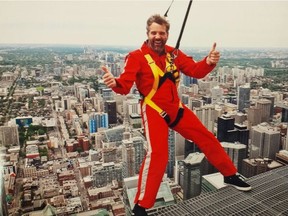 Edmonton's John Radostits, seen here navigating the exposed top of Toronto's 356-metre-high CN Tower, is taking time out from working his way down a long bucket list to chair the Alzheimer Face-Off Pro-Am Hockey tournament next month at the Terwillegar Recreational Centre.