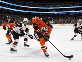 Arizona Coyotes' Jakob Chychrun (6) chases Edmonton Oilers' Leon Draisaitl (29) during second period NHL action in Edmonton, Alta., on Monday March 5, 2018.