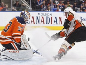 Anaheim Ducks' Ondrej Kase (25) is stopped by Edmonton Oilers' goalie Cam Talbot (33) during first period NHL action in Edmonton, Alta., on Sunday, March 25, 2018.