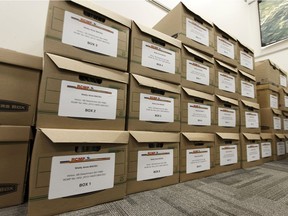 Boxes with files on the investigation of the 1983 disappearance of Shelly-Ann Bacsu from the Hinton area are seen in the RCMP Historical Homicide Unit's offices in Edmonton, Alberta on Monday, March 5, 2018. The unit investigates cold cases dating back to 1935.