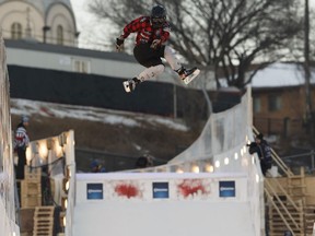 Canada's Steven Cox does a trick in the freestyle event during Red Bull Crashed Ice competiton in downtown Edmonton, Alberta on Friday, March 9, 2018.