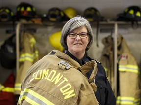 Edmonton Fire Rescue Services district chief Shirley Benson poses for a photo at Fire Station 1 in Edmonton, on Wednesday, March 21, 2018. Benson is celebrating 30 years with the service, and was the first woman firefighter hired by the city when she started.