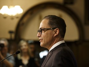 Alberta Finance Minister Joe Ceci speaks during a press conference about Budget 2018 in the Alberta Legislature in Edmonton, on Thursday, March 22, 2018.