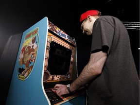 Jason Brittain, currently ranked #4 in Canada, makes a high score attempt in Donkey Kong arcade game located in the Popnology exhibit at Telus World Of Science Edmonton on Thursday, March 29, 2018. Photo by Ian Kucerak/Postmedia