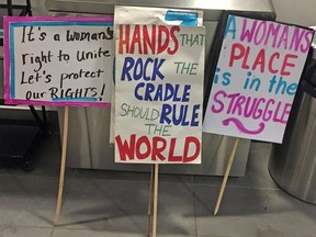 Some of the signs at the Old Strathcona Performing Arts Centre after the march held by Women 4 Rights and Empowerment for international womenís day in Edmonton, AB on Saturday, March 3, 2018.