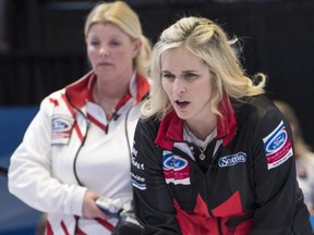 Canada skip Jennifer Jones marks a shot as Denmark skip Angelina Jensen looks on at the World Women's Curling Championship in North Bay, Ont., on Tuesday, March 20, 2018.