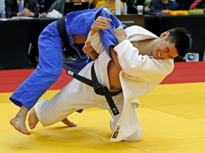 Jason Woo (right/University of Alberta Judo Club) in combat with Rashad Chin (Kodokwai Judo Club) at the 2018 Edmonton International Judo Championship at West Edmonton Mall Ice Palace on Saturday March 10, 2018. Chin won the match. The 13th annual tournament is the largest in Canada with more than 700 male and female competitors from across the country and abroad participating in the event from March 9 to 11, 2018. (PHOTO BY LARRY WONG/POSTMEDIA)