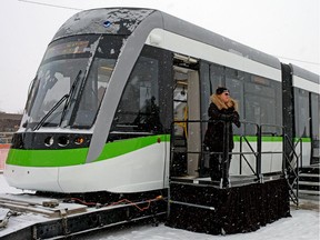 Marie-Claude Dubois (Project Administrator, Bombardier) stands outside Bombadier's new low-floor Light Rail Vehicle, which will be used on the Valley Line LRT (Light Rail Transit) in Edmonton. The train was on public display from February 2-6, 2018 at Bonnie Doon Shopping Centre in Edmonton.