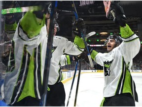 Edmonton Oil Kings Matthew Robertson (22) celebrates David Kope's, left, tying goal against the Red Deer Rebels in this file photo from Feb. 10, 2018.