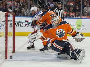 Cam Talbot of the Edmonton Oilers, watches the puck roll into the net behind him on a shot from Paul Carey of the New York Rangers at Rogers Place in Edmonton  on March 3, 2018.
