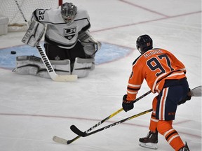 Edmonton Oilers Connor McDavid (97) scores his second goal on Los Angeles Kings goalie Jonathan Quick during second period NHL action at Rogers Place in Edmonton, March 24, 2018.