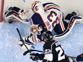 Los Angeles Kings forward Dustin Brown scores a goal that was later disallowed for goalie interference against Edmonton Oilers netminder Cam Talbot on Feb. 24.